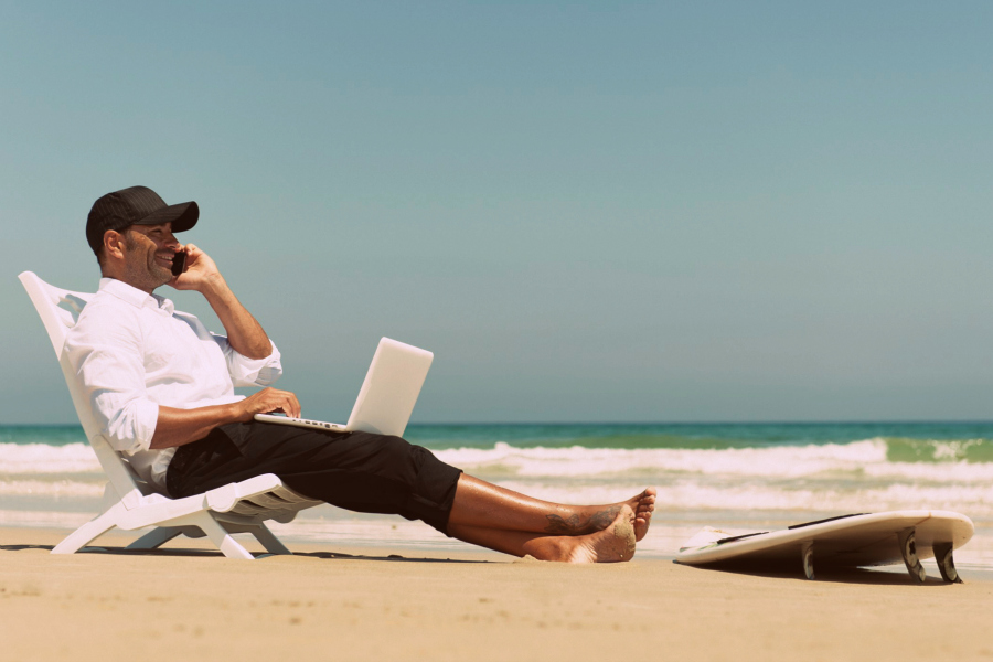 Guy on Beach with Laptop